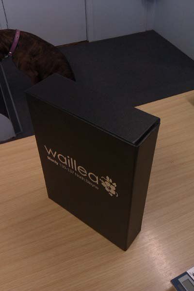 black cover with silver print standing on table