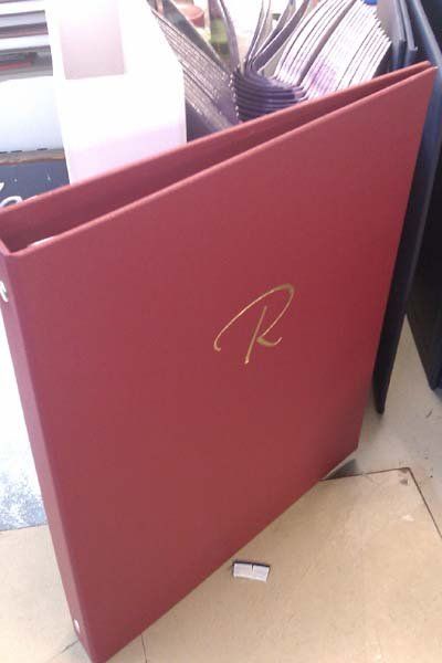 red binder with R