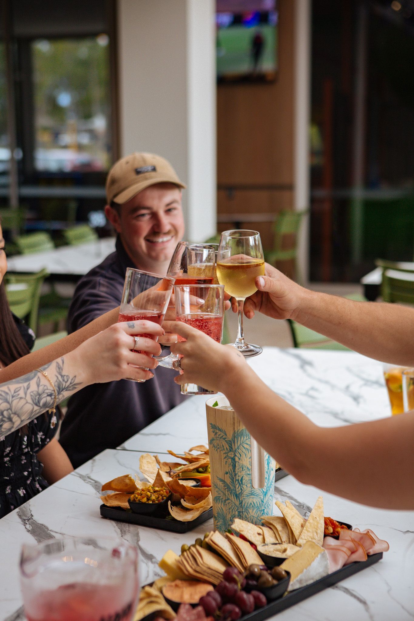 A woman is pouring wine into a glass at a bar at Para Hills Community Club