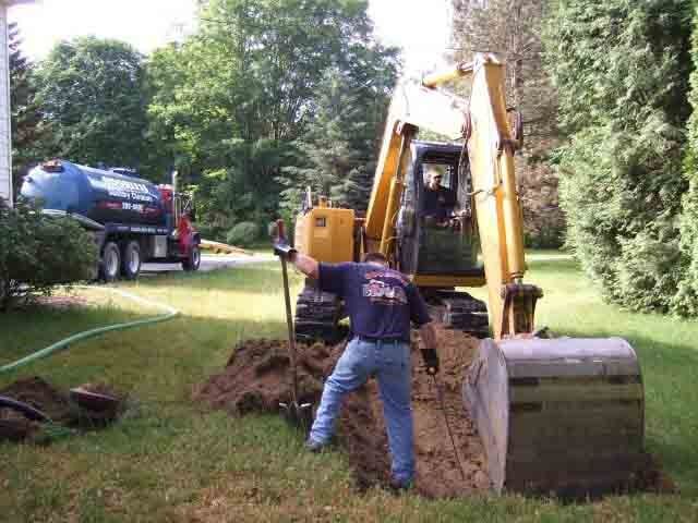 Man digging the land with excavator - Septic tank cleaning Residential in Ballston Lake, NY