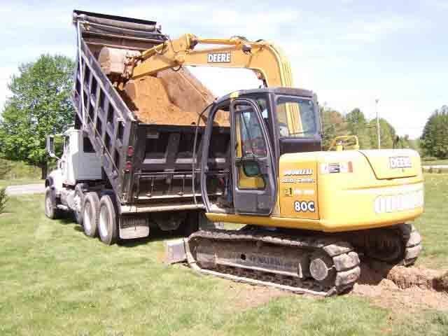 Excavator hooking up soil - Septic tank cleaning Residential in Ballston Lake, NY