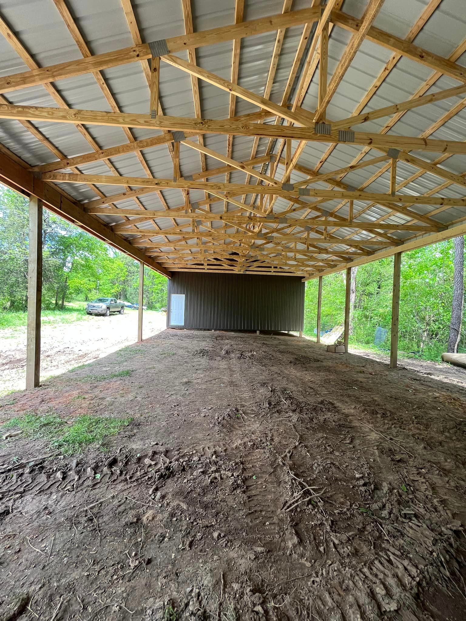 There is a lot of dirt under the roof of the building.