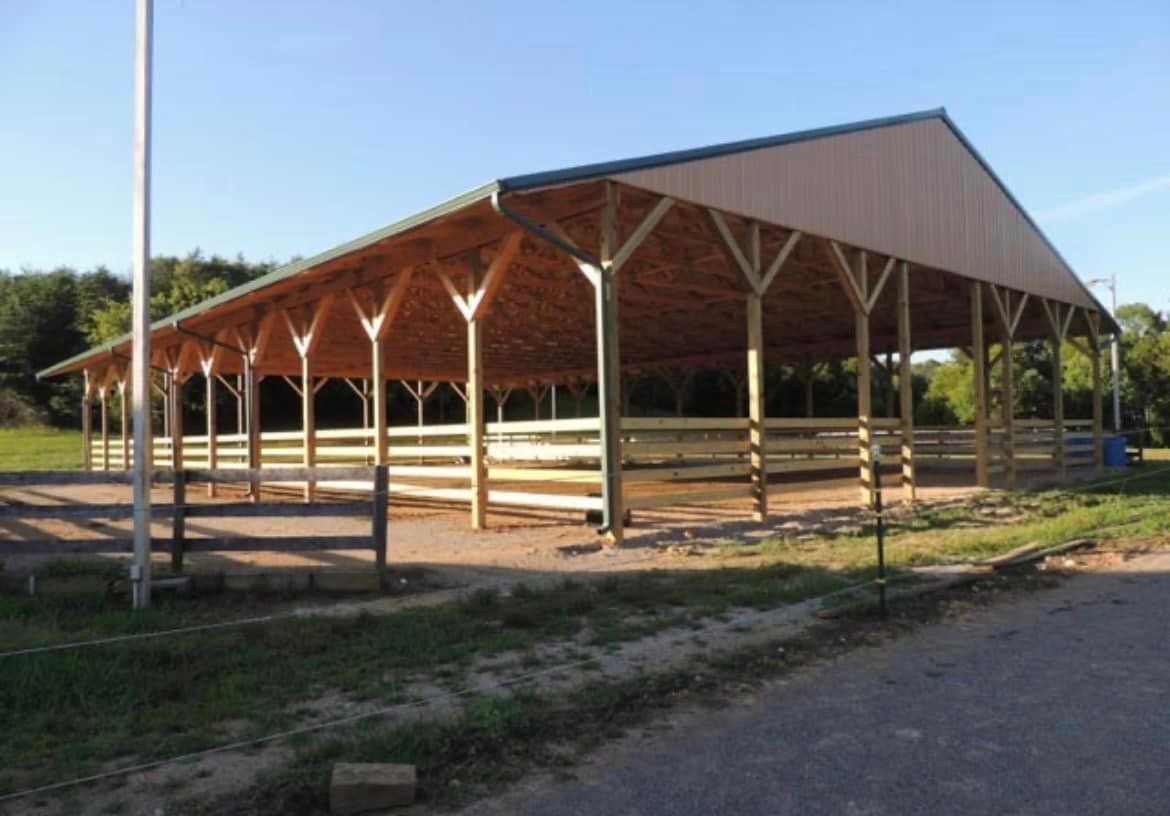 A large wooden building with a fence around it