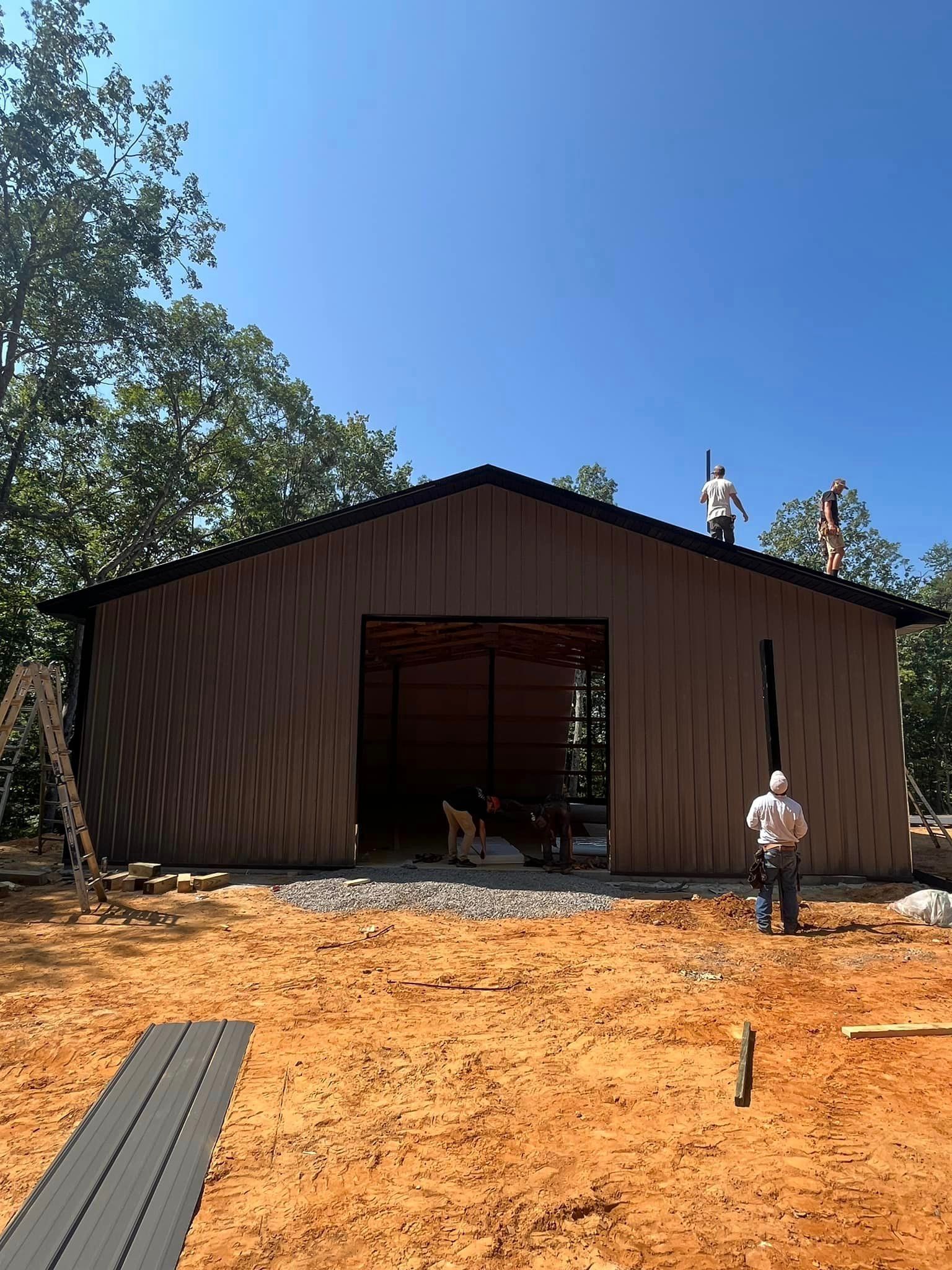 A man is standing on the roof of a building.