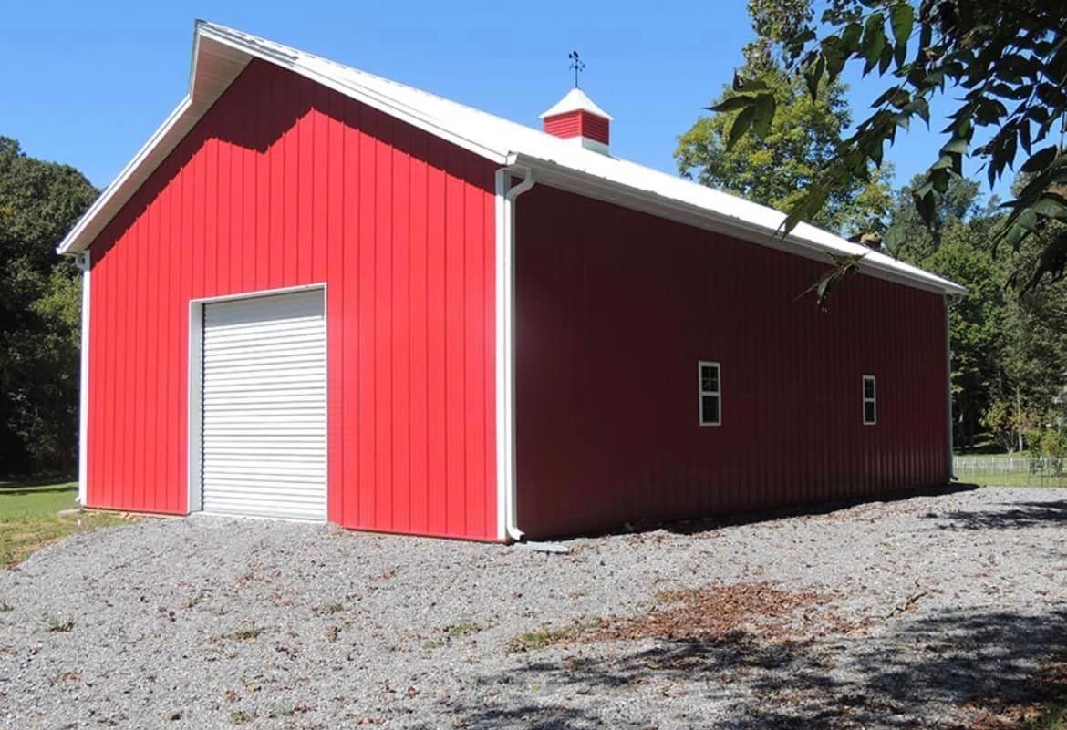 A large red barn with a white roof