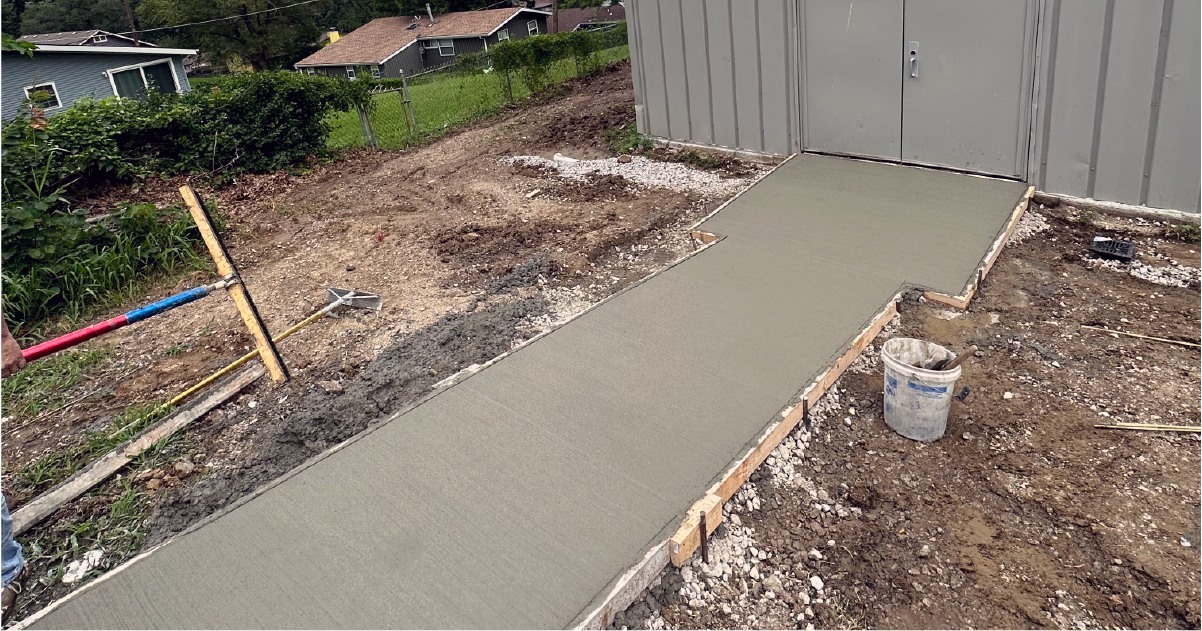 Wet concrete poured at church shed