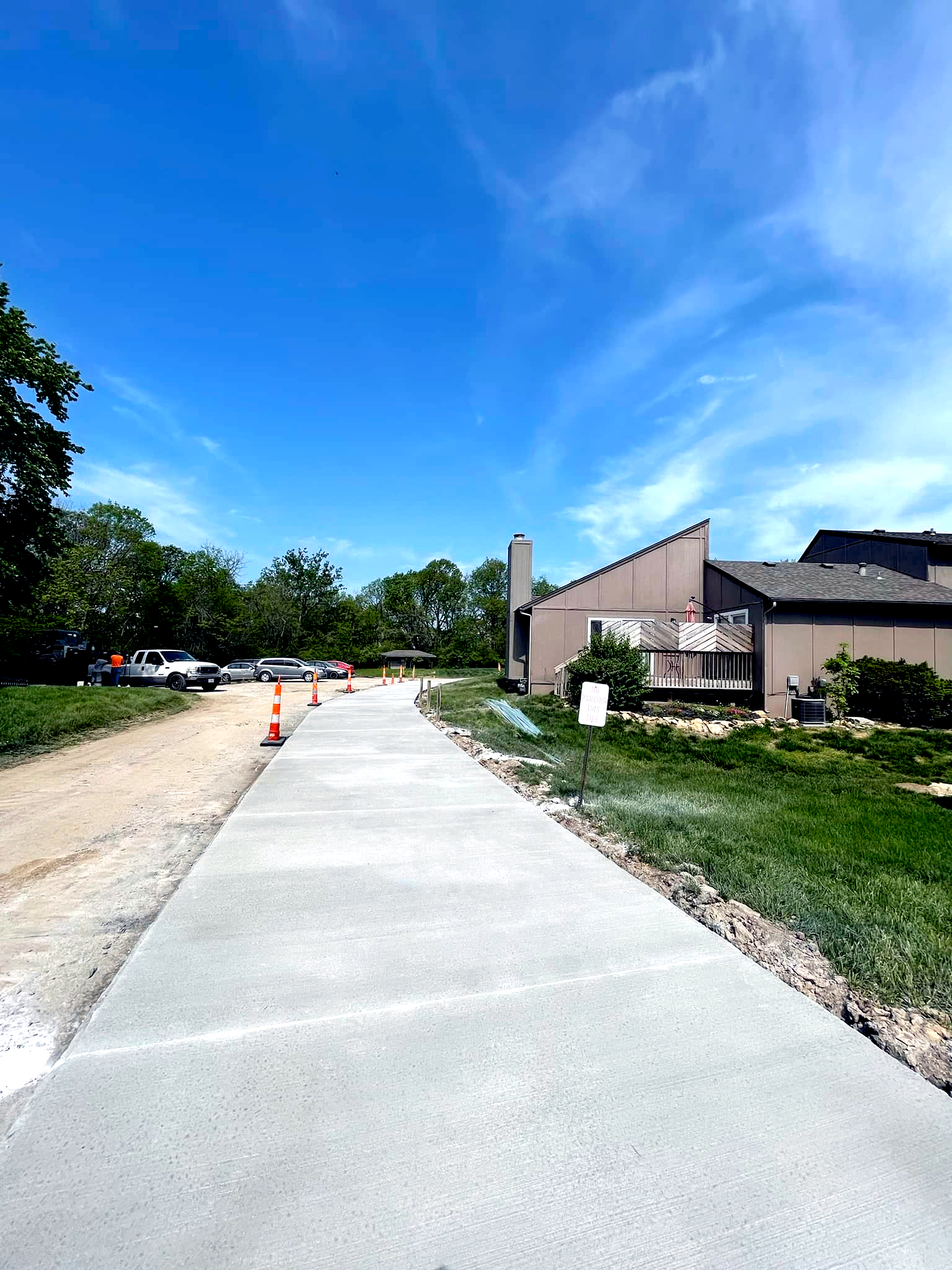 Concrete sidewalk outside of an apartment complex