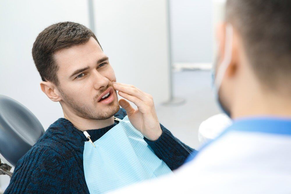 Man Having Toothache — Dental Services in Gympie, QLD