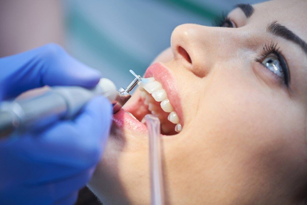 Polishing Teeth of Woman — Dental Services in Gympie, QLD