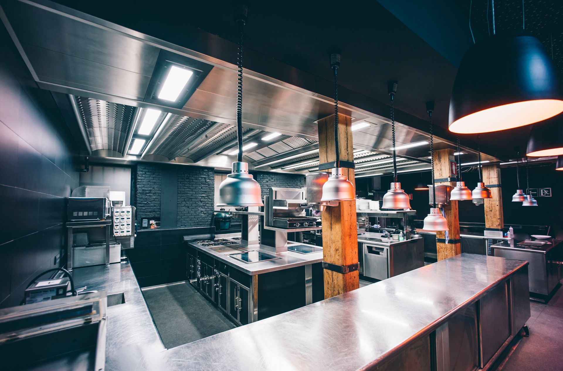 Interior of an illuminated commercial kitchen in a restaurant