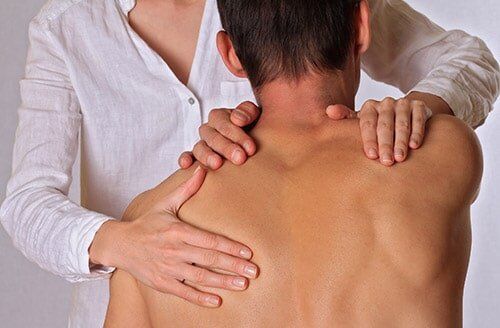Man Having Chiropractic Back Adjustment — Chiropractic in Maryville, TN