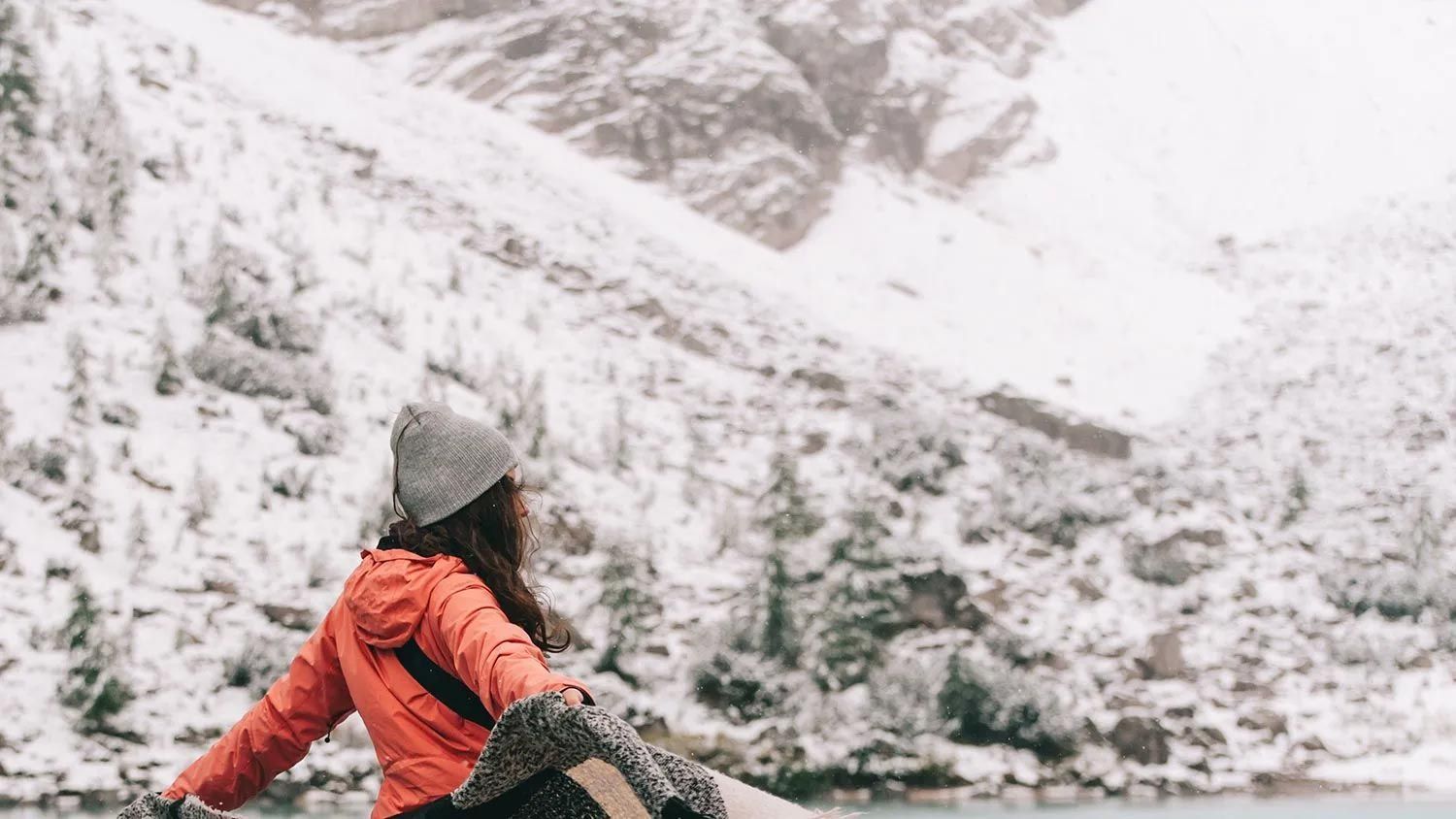 A woman is looking out over an Antarctic landscape. A woman is looking out over an Antarctic landscape.