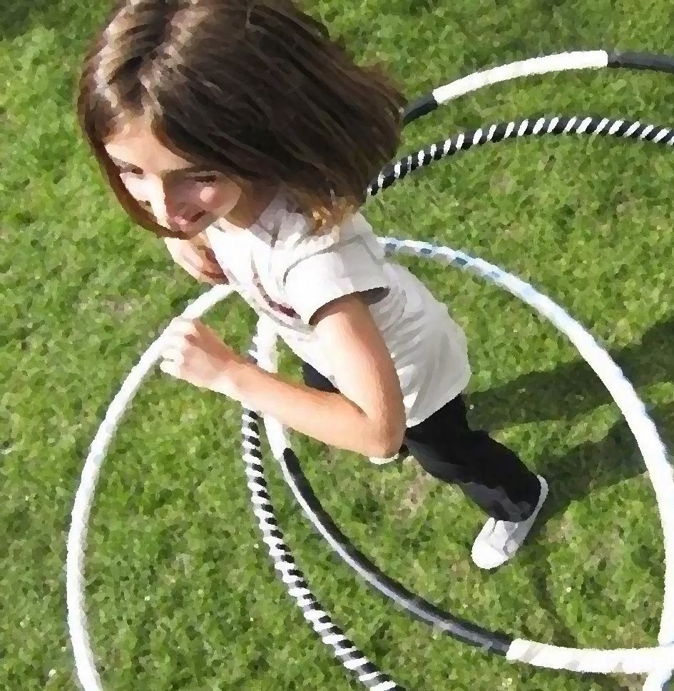 Girl playing with hula hoops