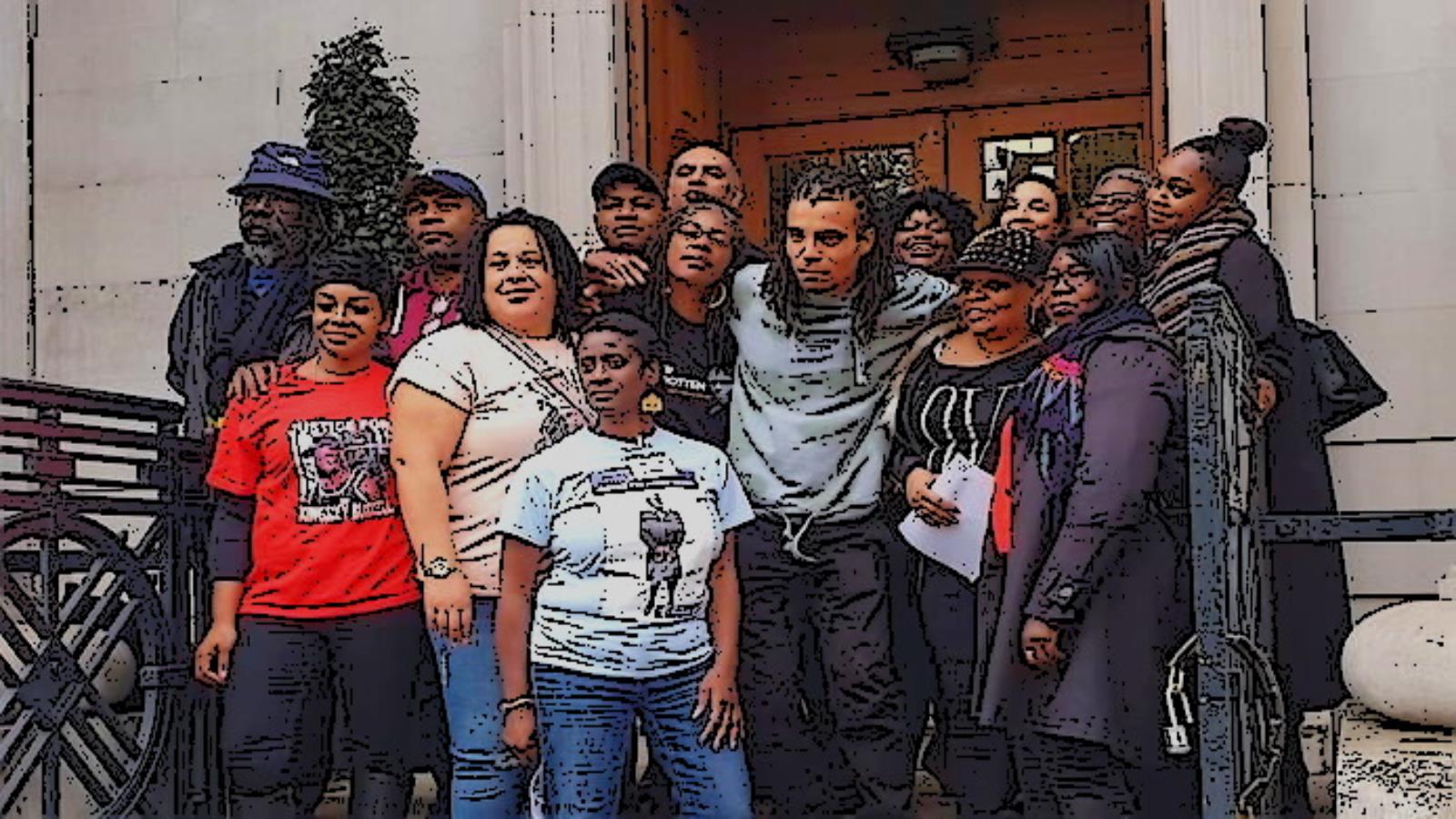 A group of families pose for picture