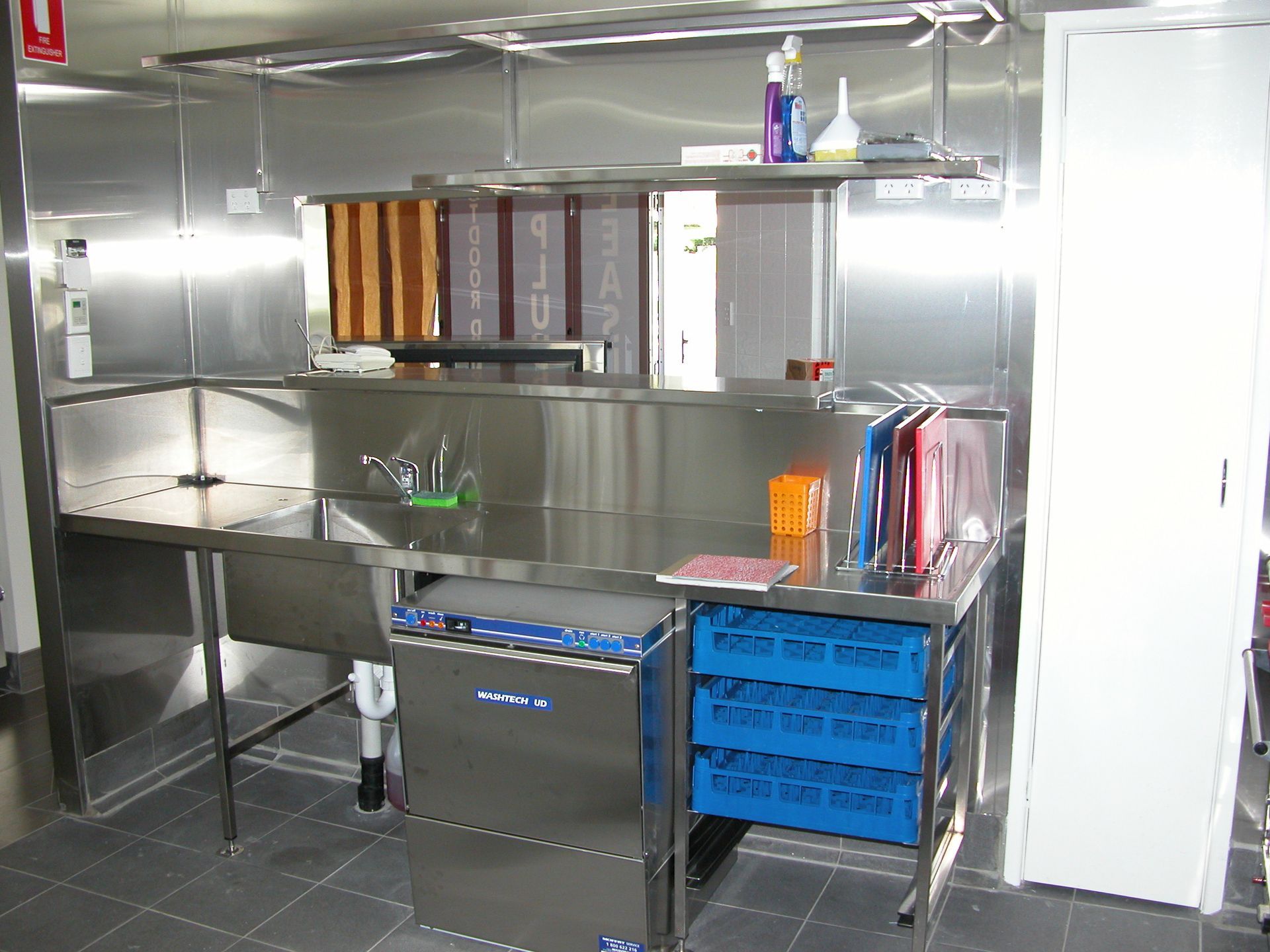 A kitchen with stainless steel appliances and a sink