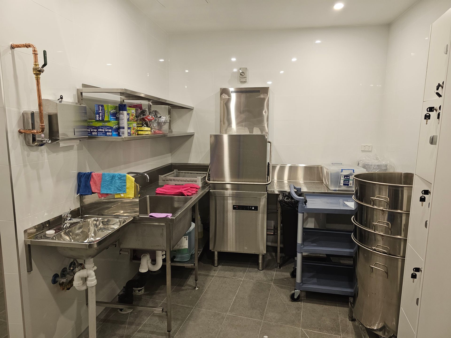 A kitchen with stainless steel appliances and a sink.