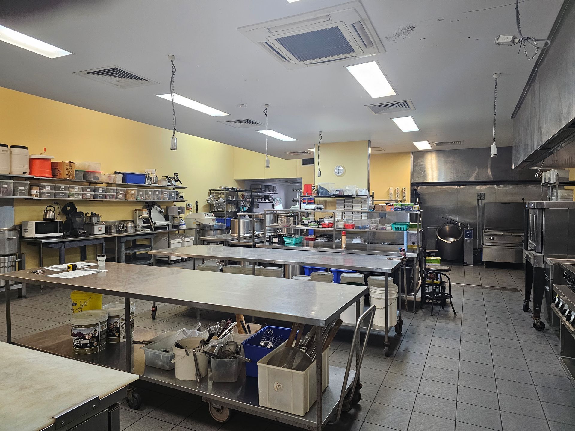 A kitchen with stainless steel appliances and a sink.
