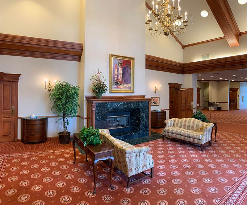 A living room with a fireplace and a couch