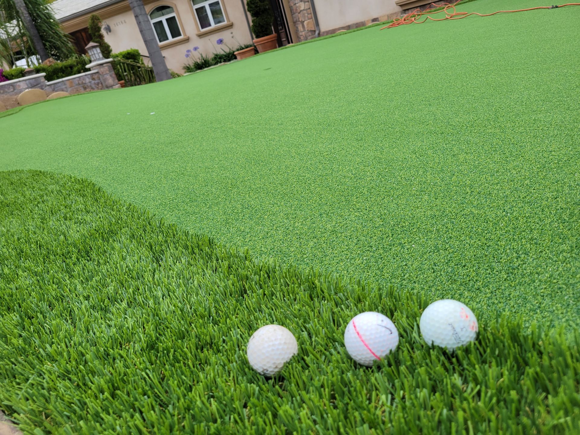 golf balls on  synthetic putting green