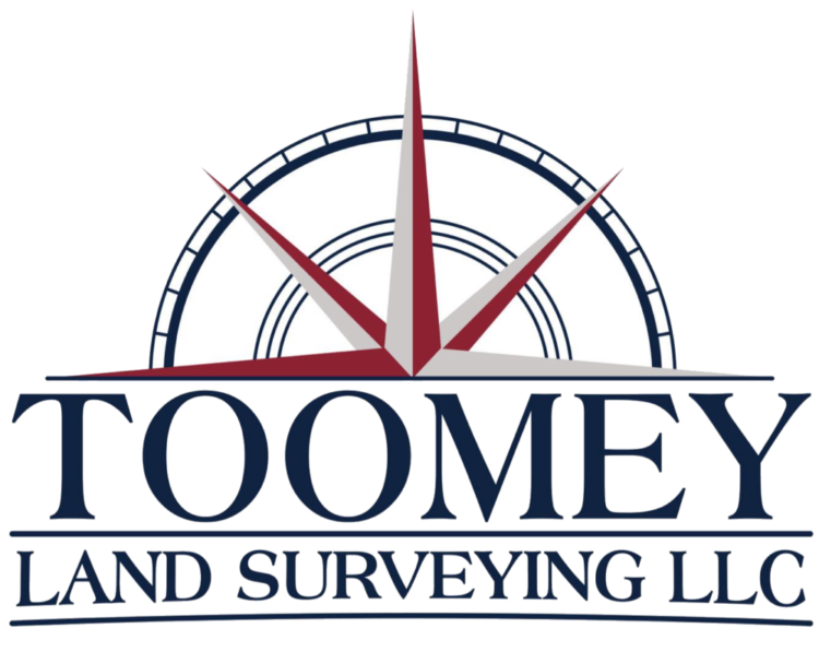 Toomey Land Surveying LLC logo with navy text and a red compass graphic