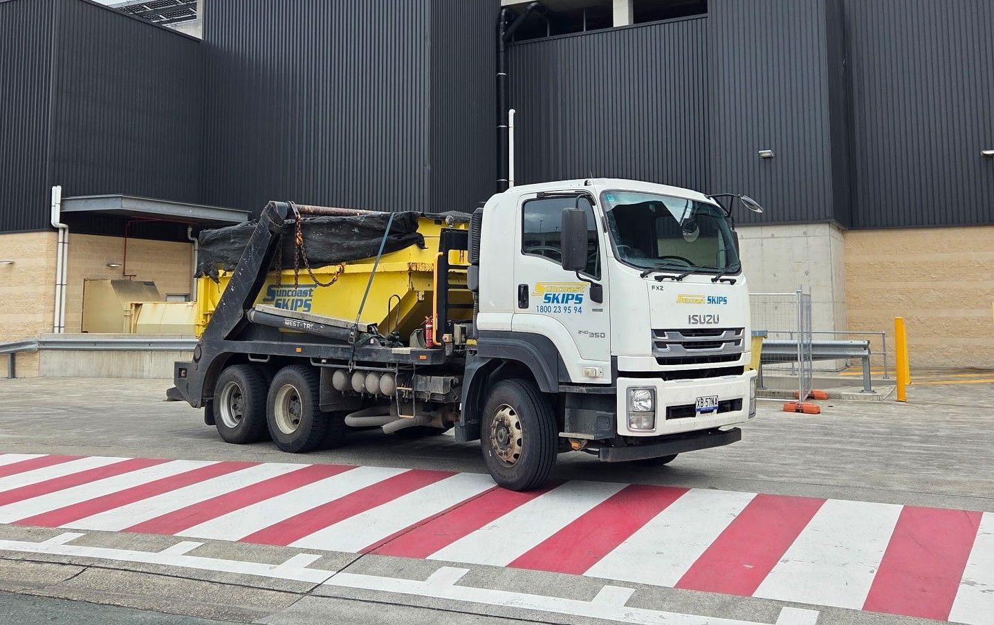 a vehicle carrying a skip bin - Suncoast Skips 