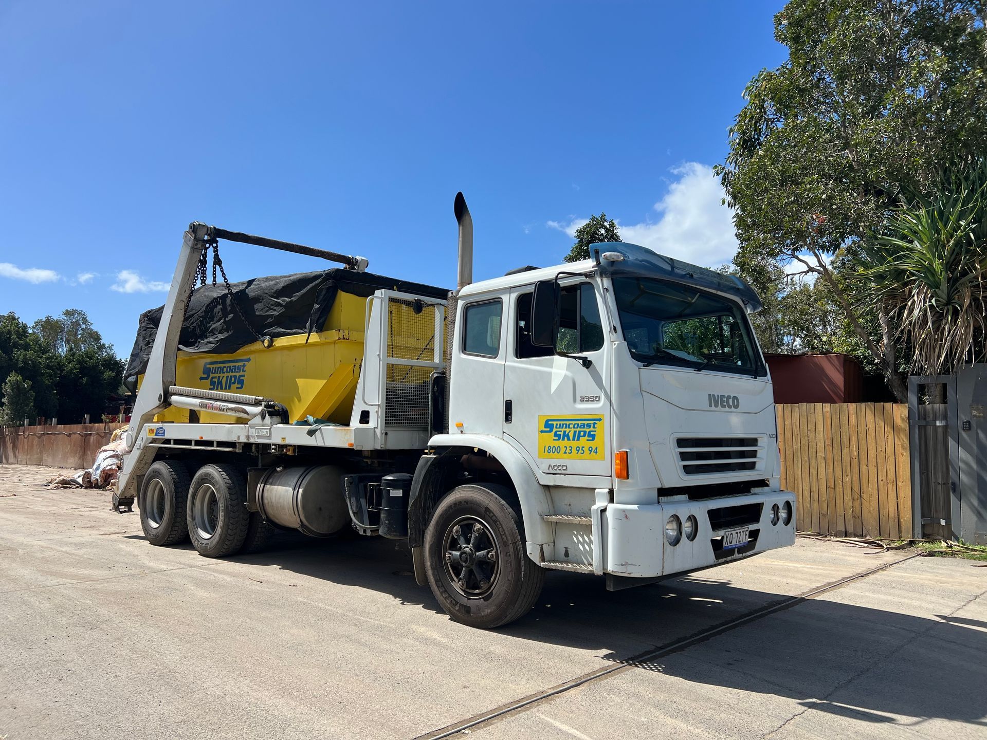 a vehicle carrying a skip bin - Suncoast Skips 