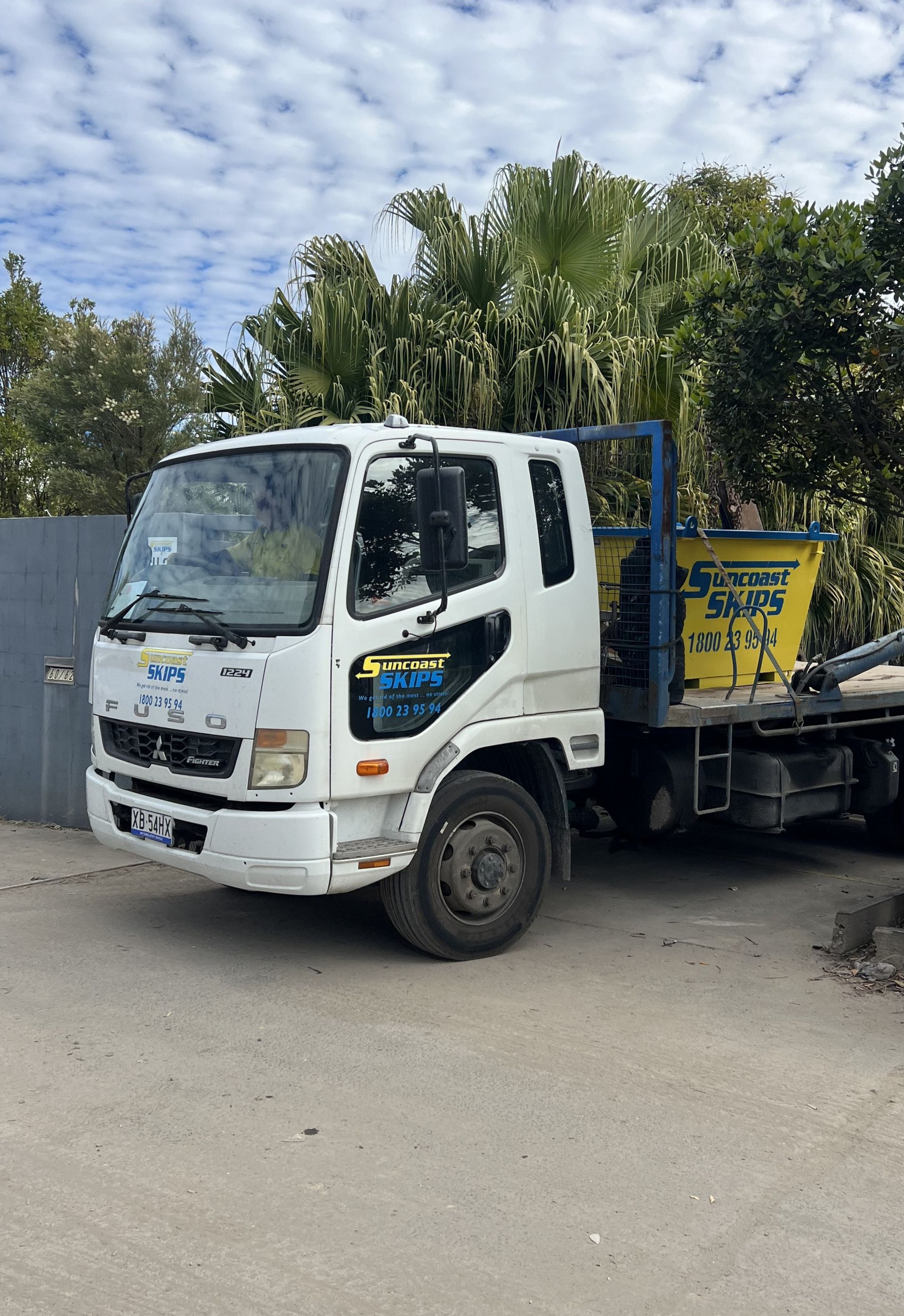 Yellow Skip Bin being lifted by a crane truck— Suncoast Skips in Coolum Beach, QLD