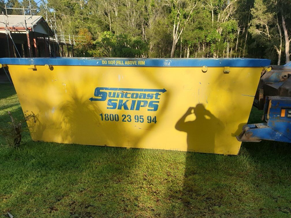 A Yellow skip bin With the Word Skips on It — Suncoast Skips in Coolum Beach, QLD