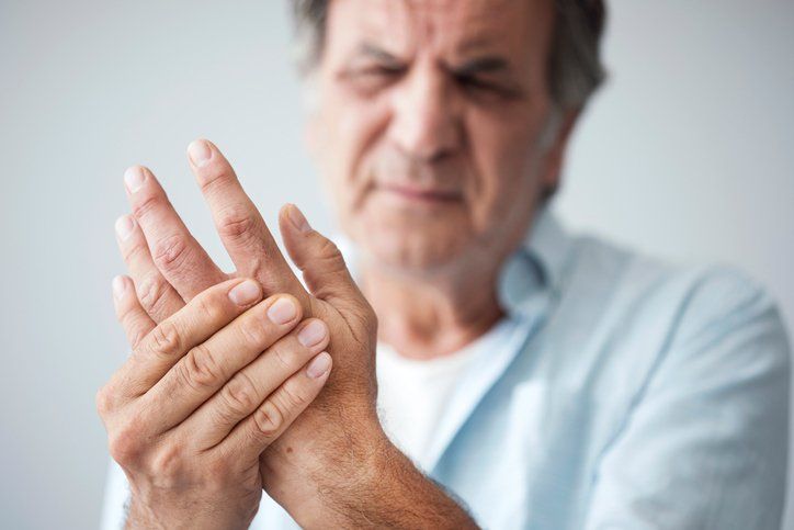 Old Man with Hand Pain — Grand Island, NE — Heartland Pain Clinics