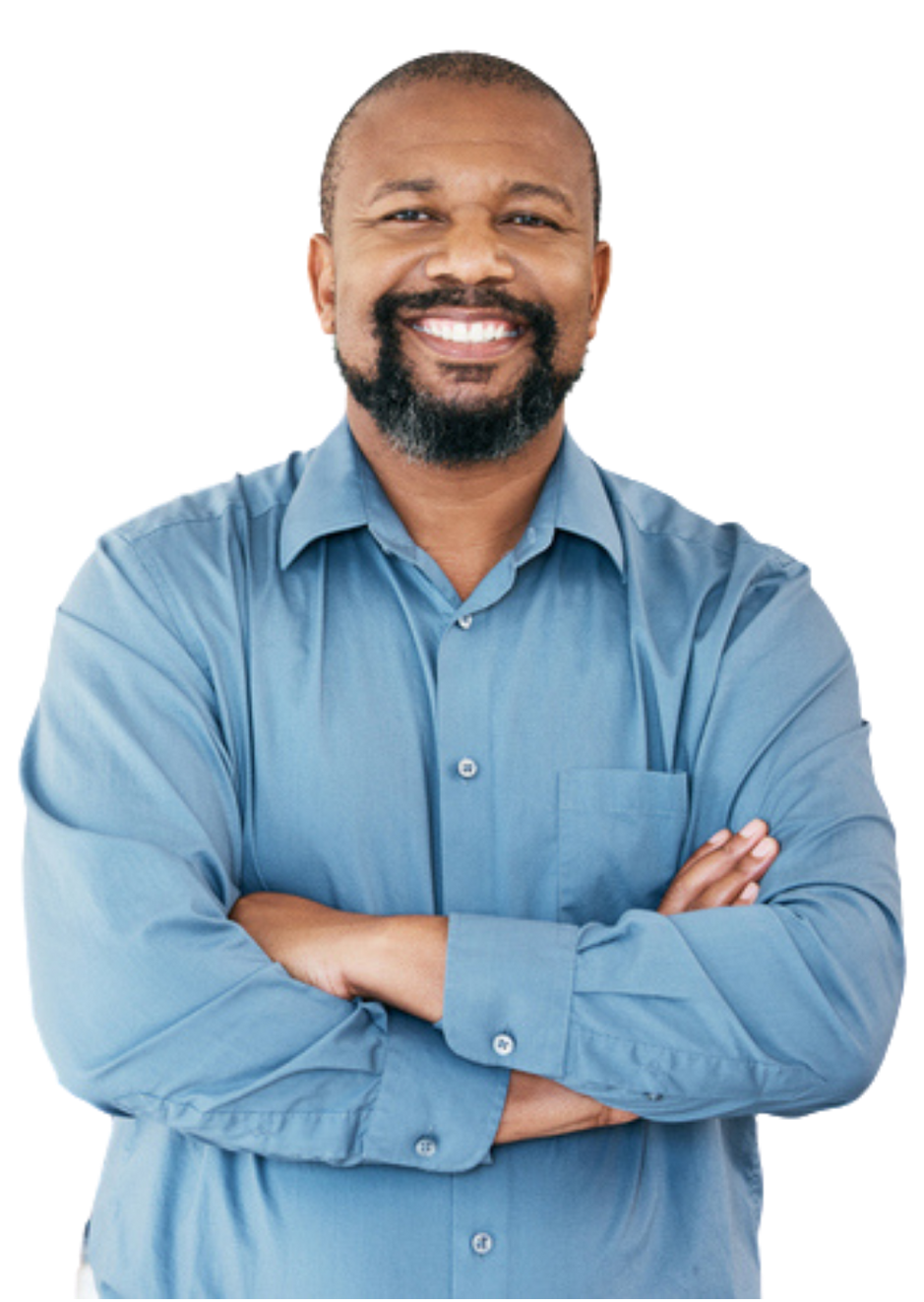 A man in a blue shirt is standing with his arms crossed and smiling