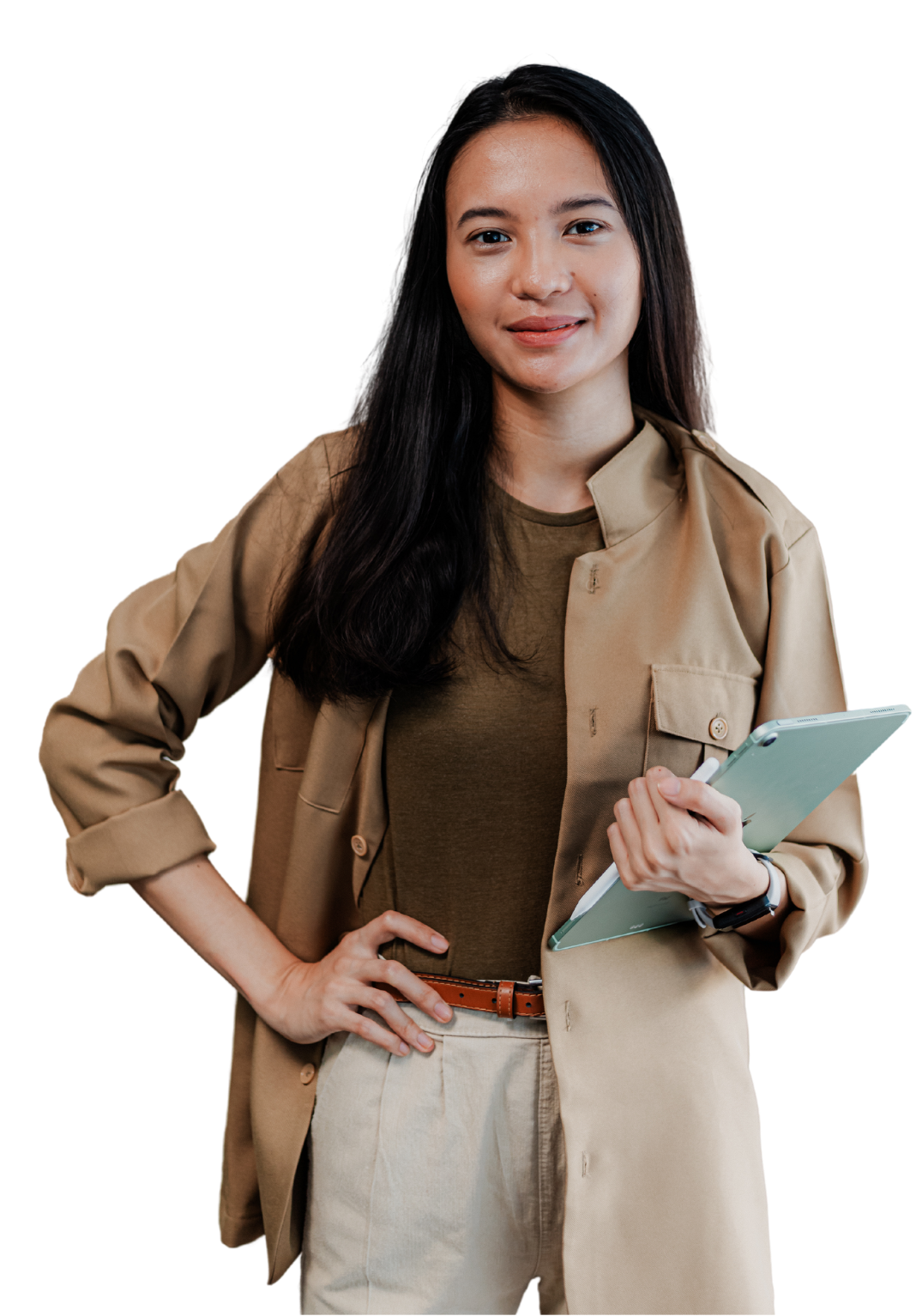 A woman is holding a clipboard and smiling while standing with her hands on her hips.