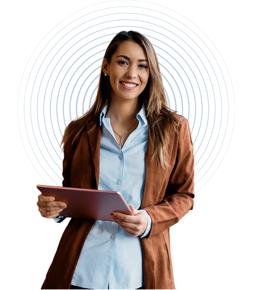 A woman is holding a tablet in her hands and smiling.