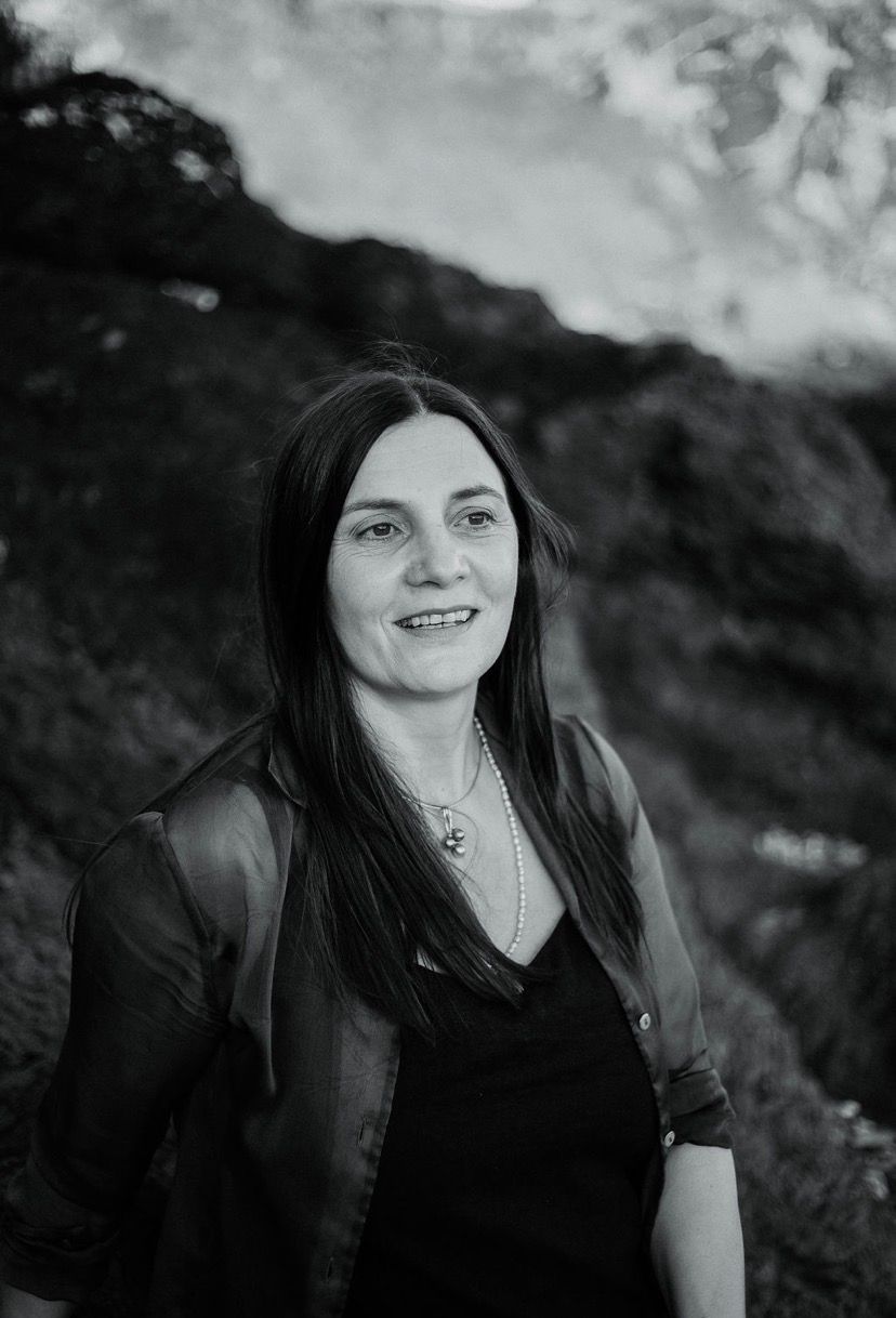 A Woman In A Blue And Green Saree Standing On A Balcony — Vedic Meditation & Coherence Personal Counselling in Coffs Harbour, NSW