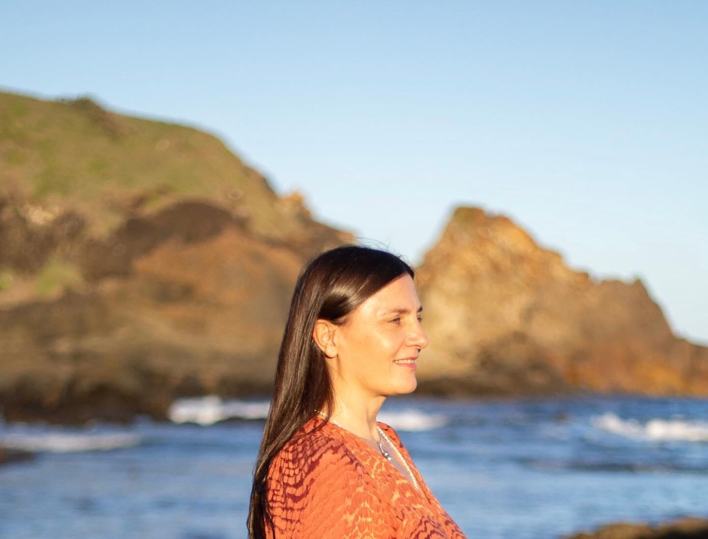 A person with long brown hair, wearing a black dress and patterned shawl — Vedic Meditation & Coherence Personal Counselling in Coffs Harbour, NSW