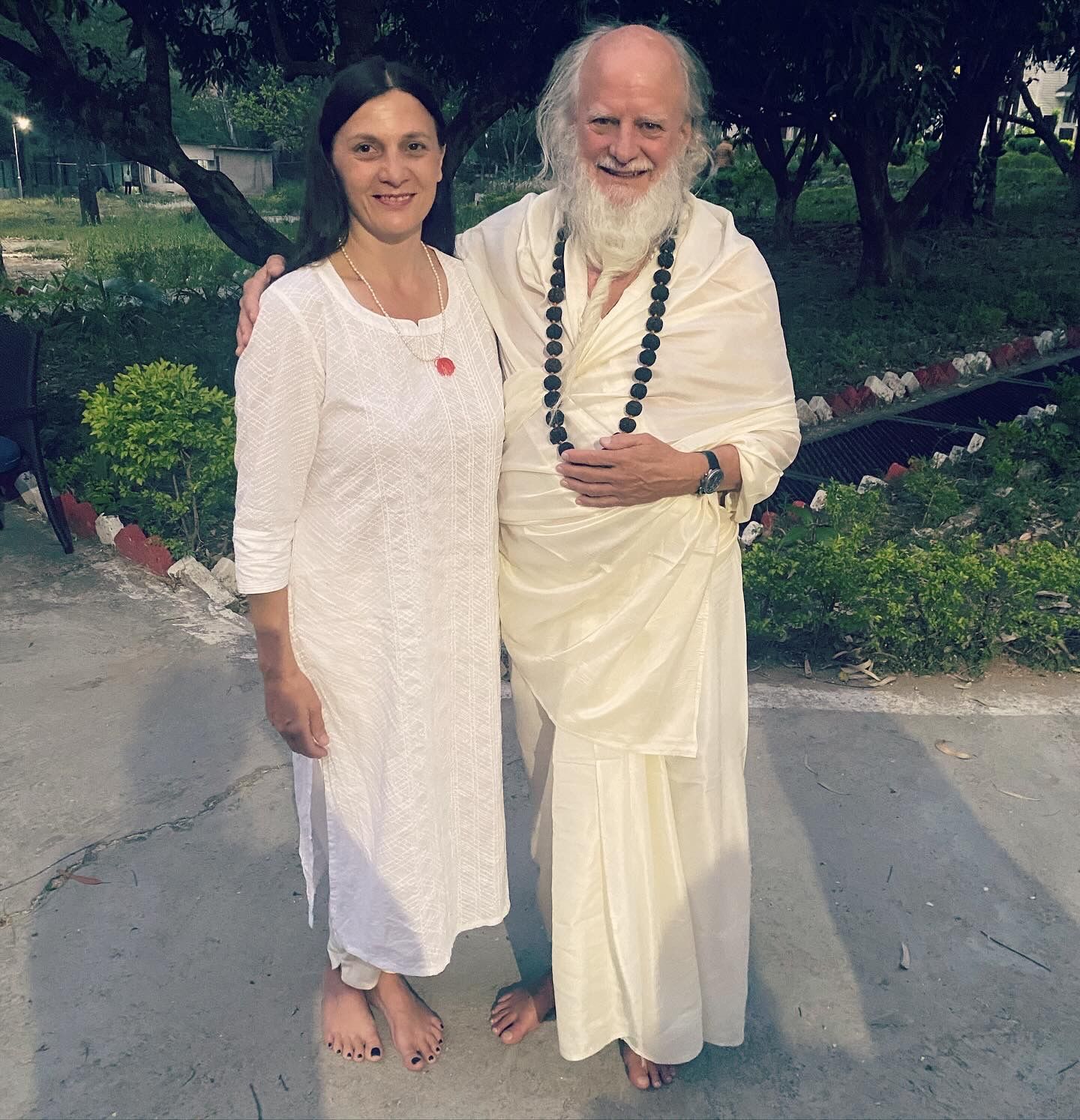 A Man With A Beard Standing Next To A Woman In A White Dress — Vedic Meditation & Coherence Personal Counselling in Coffs Harbour, NSW