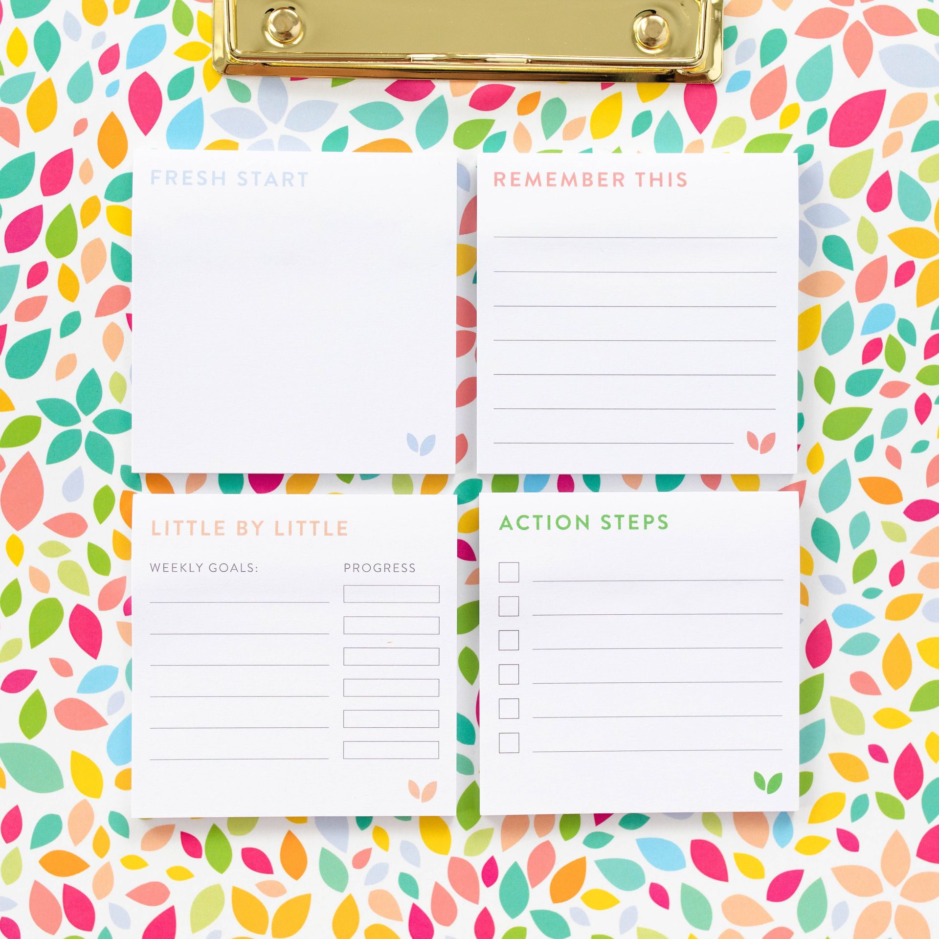 A clipboard with a bunch of sticky notes on it
