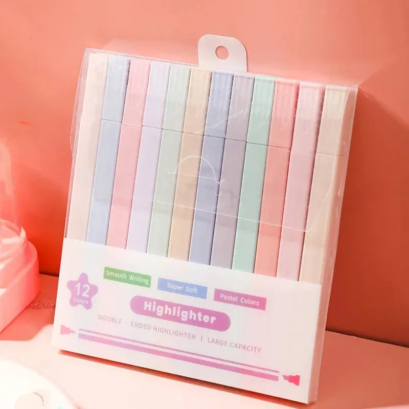 A box of pastel colored highlighters is sitting on a table.
