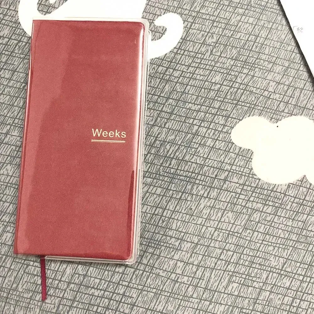 A red book with the word weeks on it