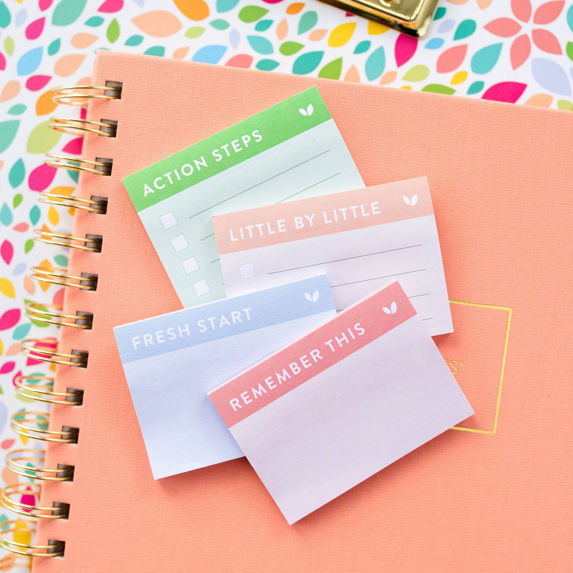 A bunch of sticky notes that say action steps little by little fresh start and remember this
