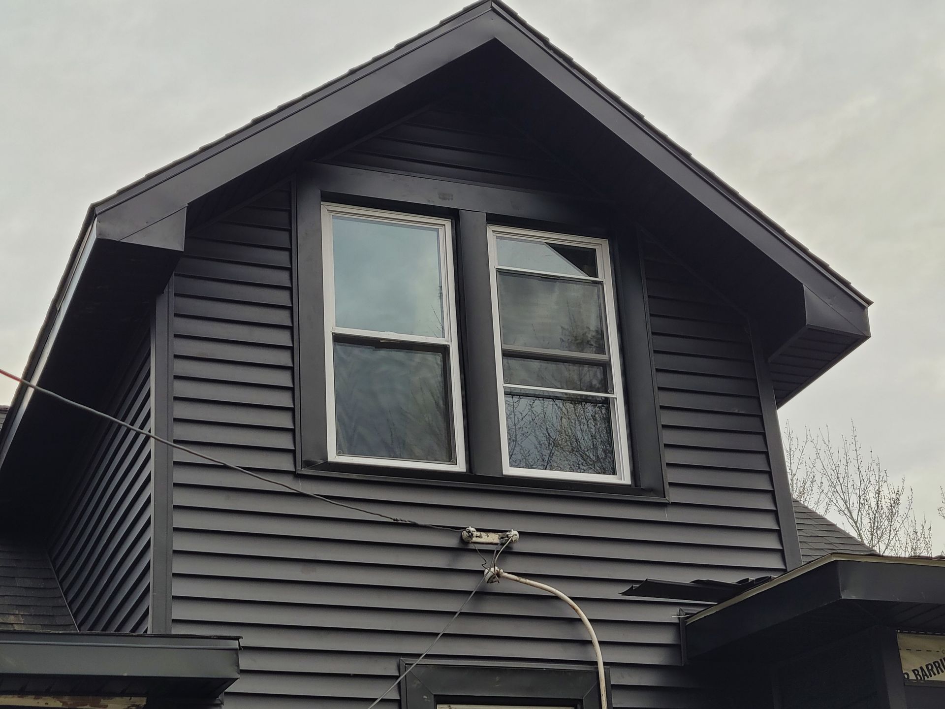 Central Square NY home, new dark siding, and metal, soffit and fascia to match
