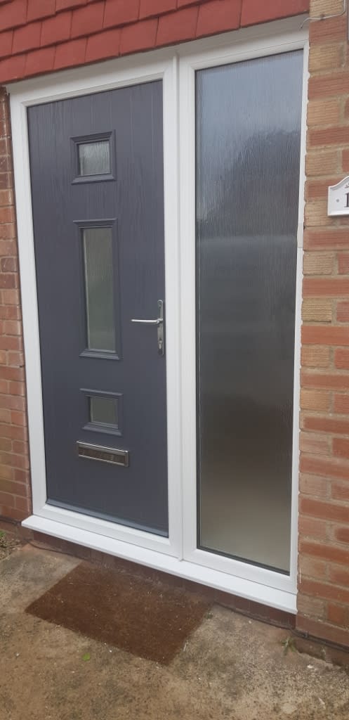 Modern front door and full lenth window at front of house