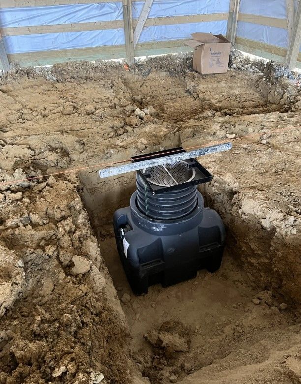 Yellow Excavator is digging Dirt on a Construction Site - Cedar Rapids, IA - Venture Concrete & Excavating LLC