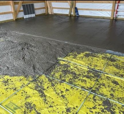 Construction Worker pouring a Wet Concrete at Road Construction Site - Cedar Rapids, IA - Venture Concrete & Excavating LLC