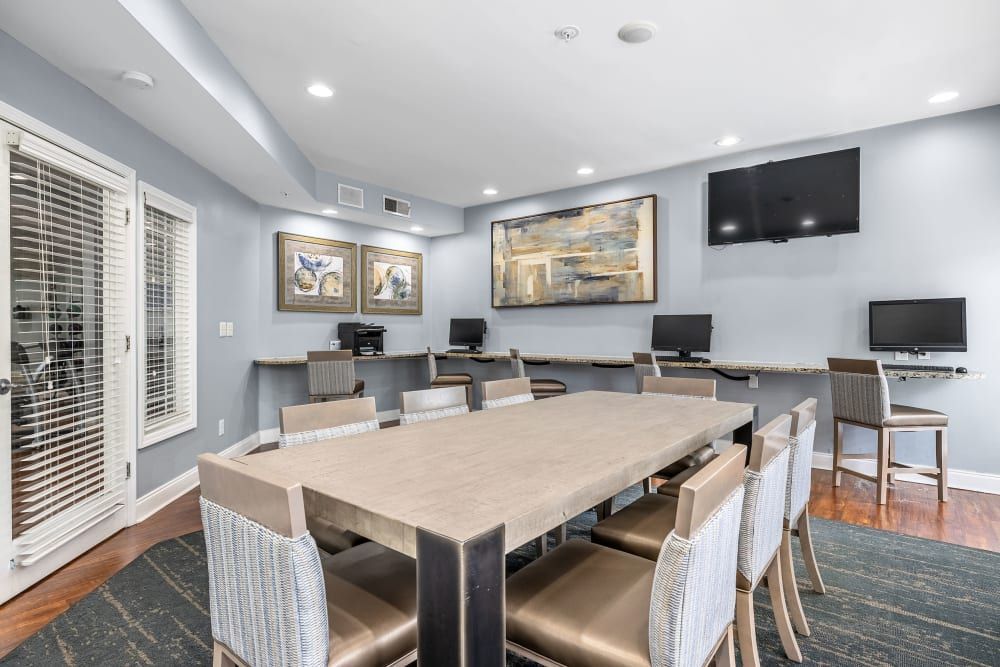 there is a large table and chairs in the room at Marquis Midtown West in Atlanta, GA.