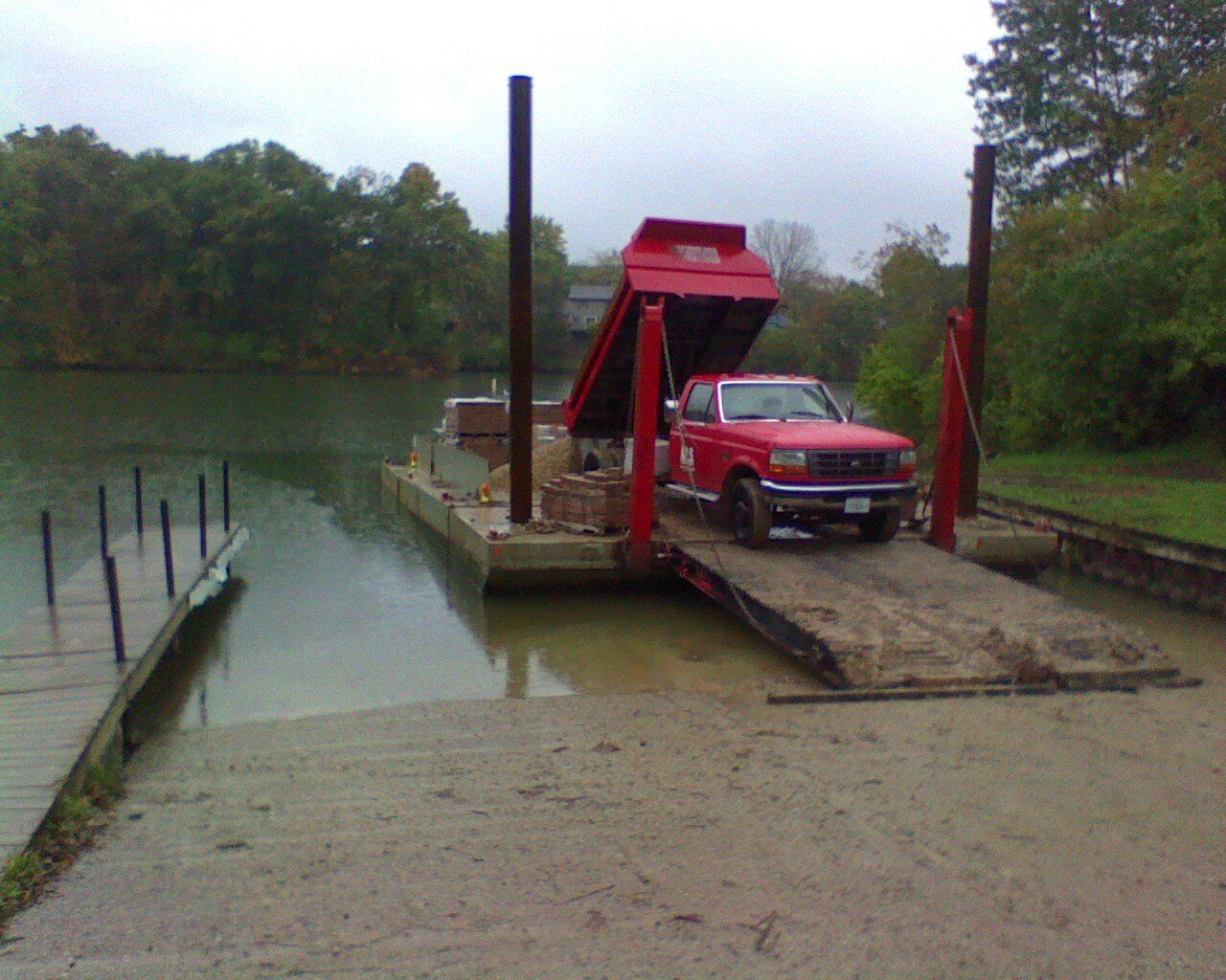 Dump truck on barge