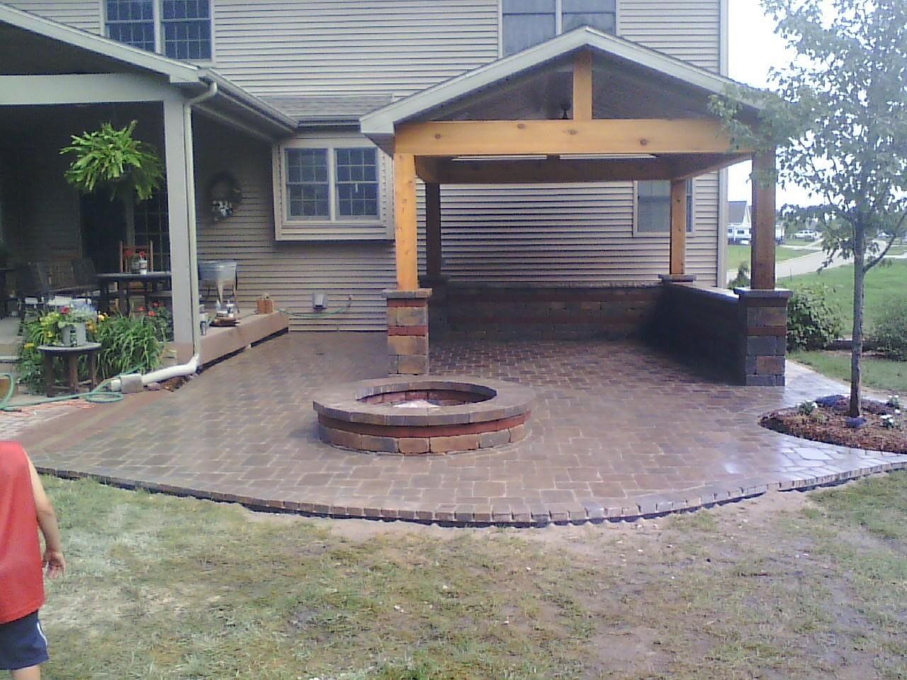 A house with a fire pit in front of it