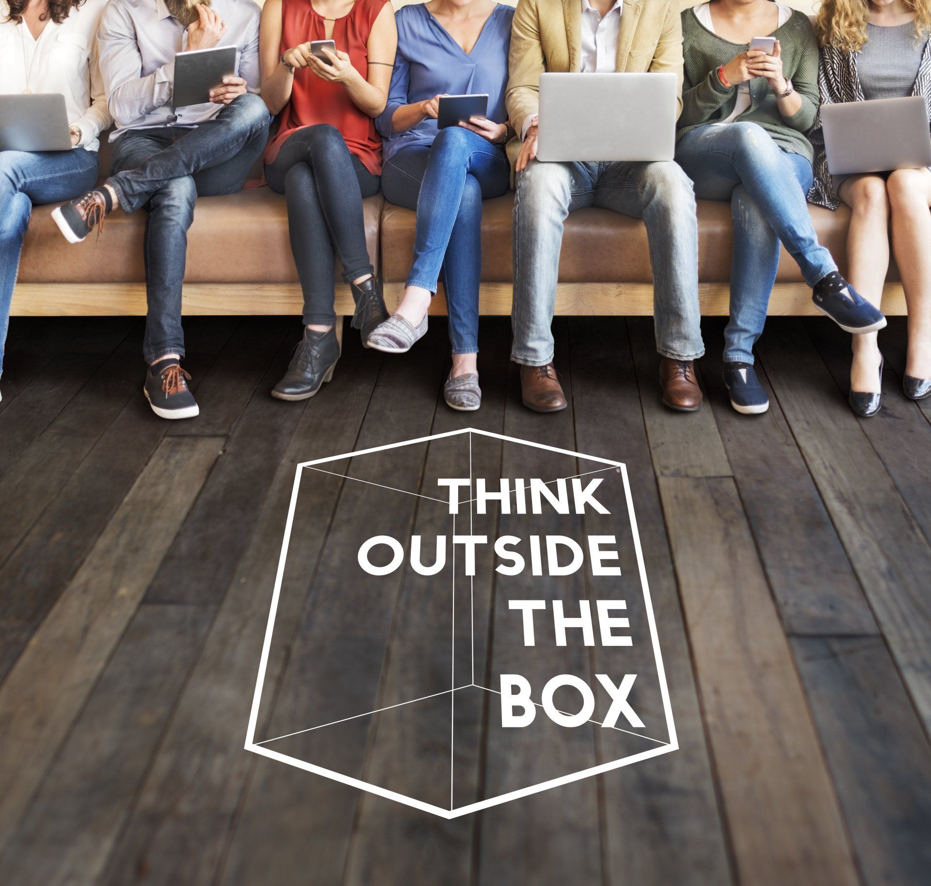 Graphic showing a group of people on a bench and the words think outside the box on ground infront of them