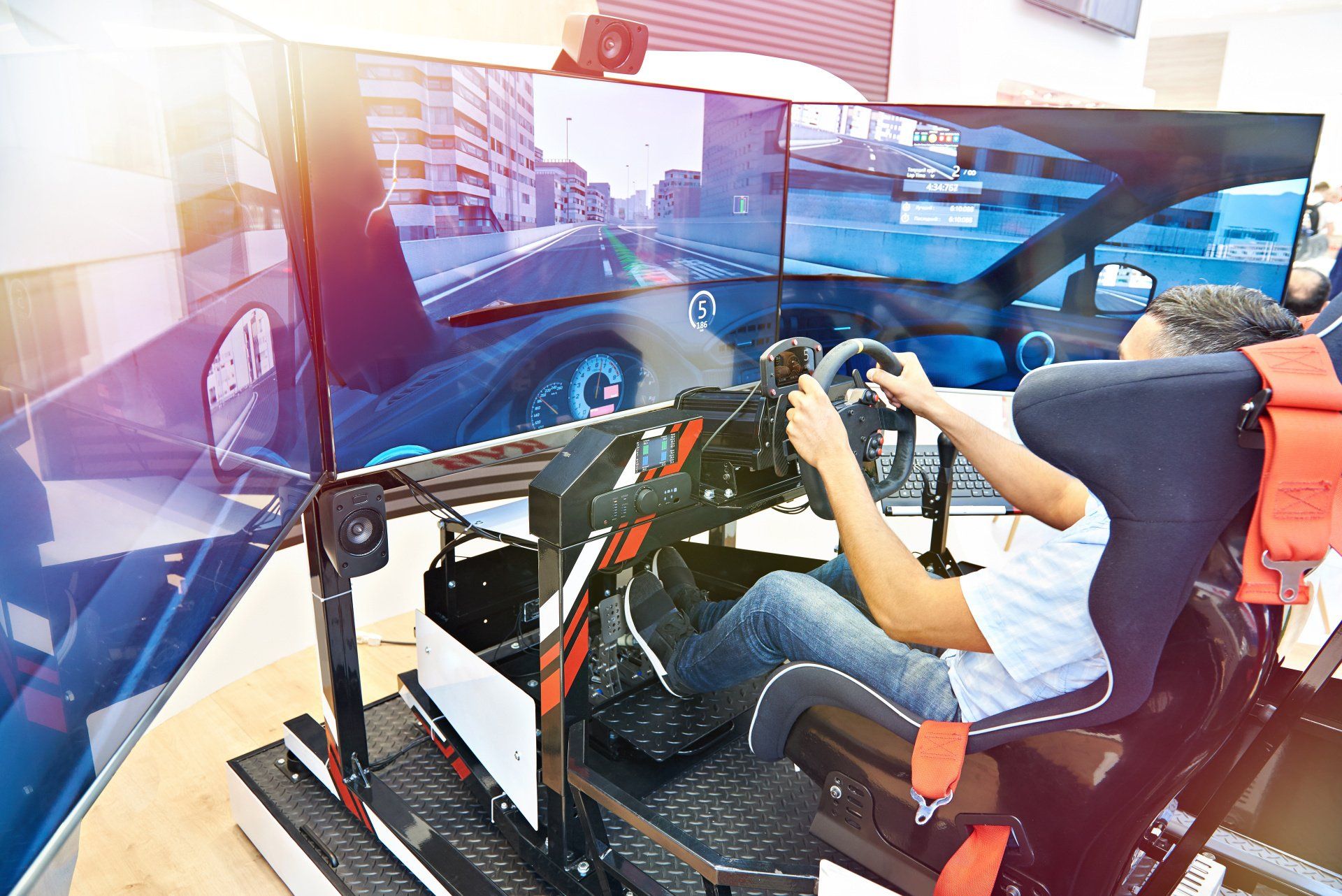 A photograph of someone driving a car simulator