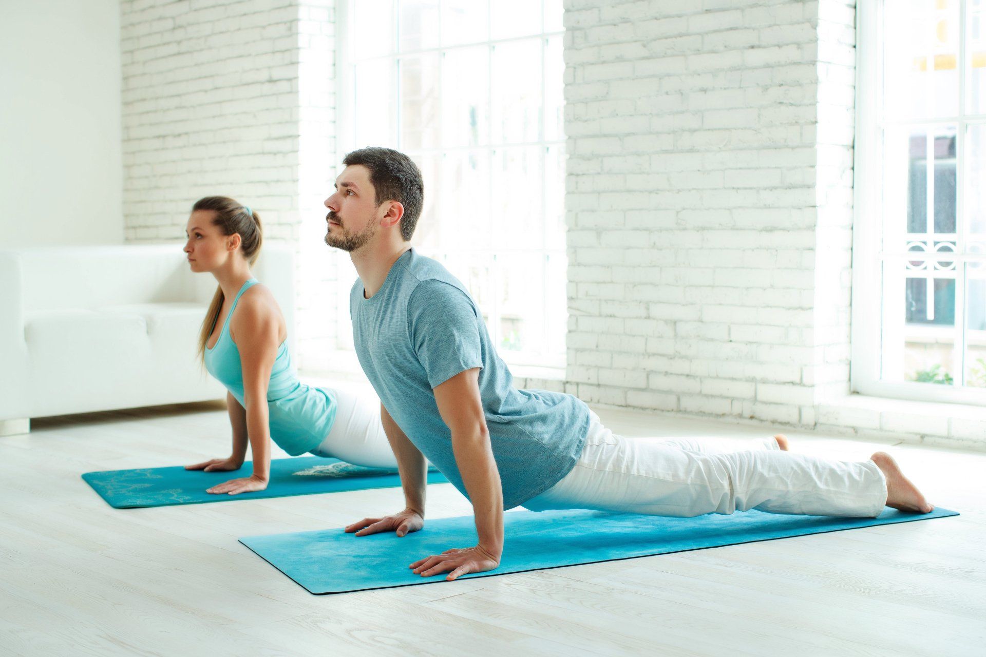 Couple practising yoga