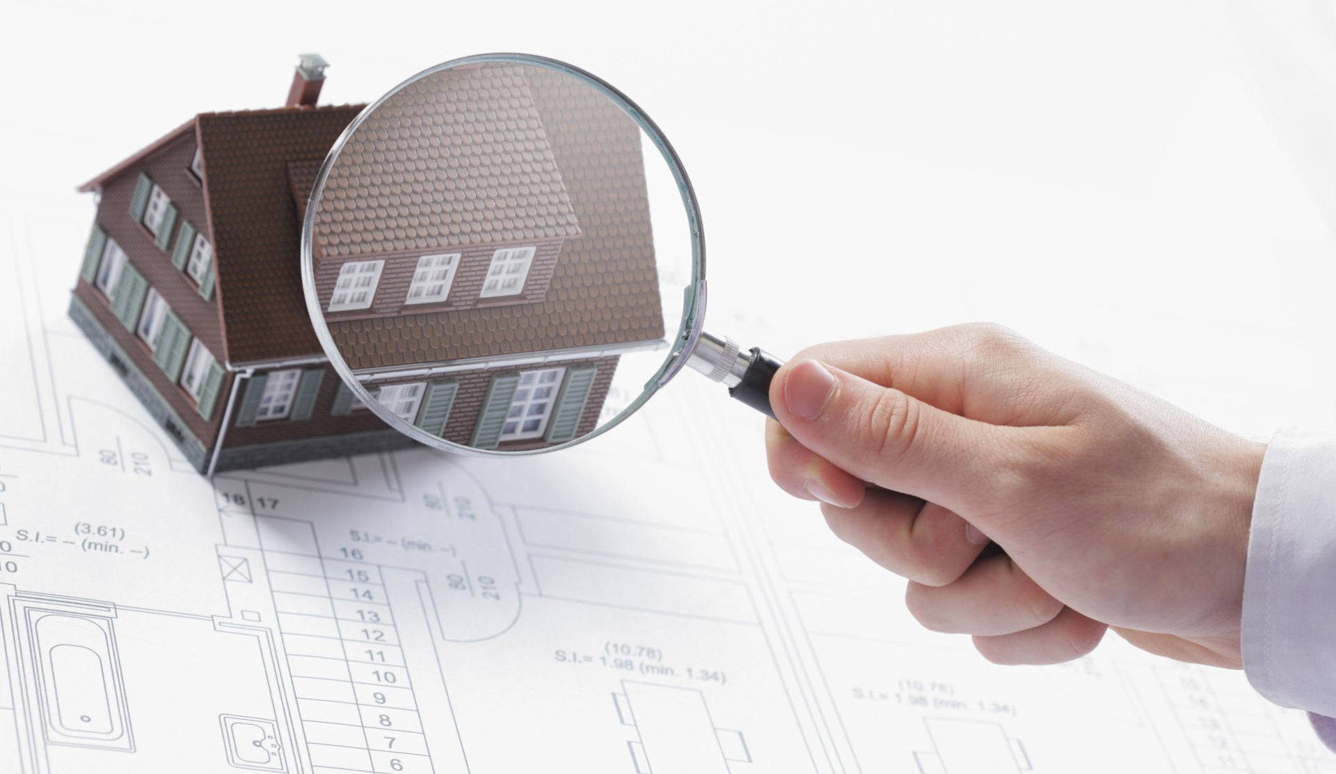 a render of a house under a magnifying glass